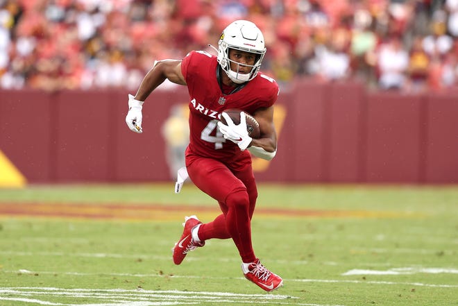 LANDOVER, MARYLAND - SEPTEMBER 10: Rondale Moore #4 of the Arizona Cardinals runs after a catch during the third quarter against the Washington Commanders at FedExField on September 10, 2023 in Landover, Maryland. (Photo by Scott Taetsch/Getty Images)