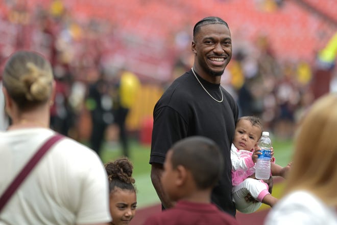 Sep 10, 2023; Landover, Maryland, USA; Robert Griffin III, former professional football quarterback, walks on the field before the game between the Washington Commanders and the Arizona Cardinals at FedExField. Mandatory Credit: Tommy Gilligan-USA TODAY Sports