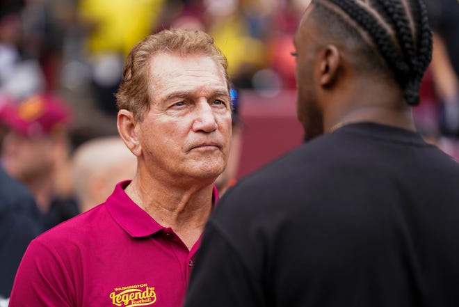 Sep 10, 2023; Landover, Maryland, USA; Former professional football players Joe Theismann (left) speaks with Robert Griffin III before the Washington Commanders and Arizona Cardinals game at FedExField. Mandatory Credit: Brent Skeen-USA TODAY Sports